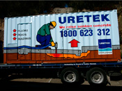 Hand painted and vinyl signage to container